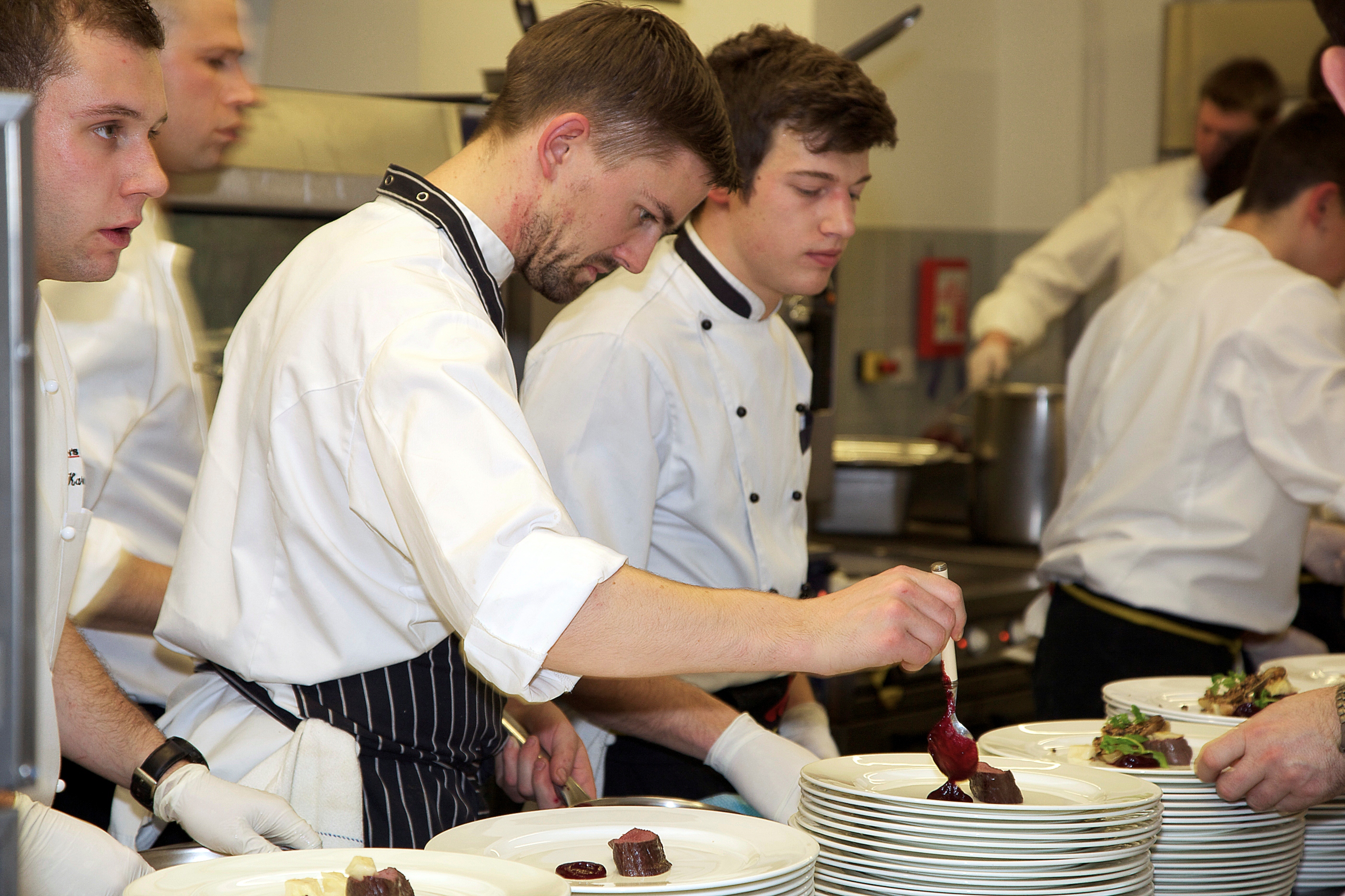 Great British Chefs Dinner – Robert Thompson putting the finishing touches to the meat course